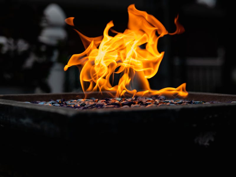 Colorful outdoor fire pit burning with vibrant flames