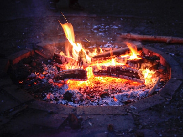 Outdoor campfire gathering in the evening